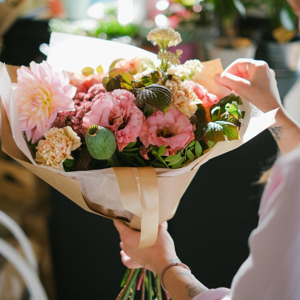 Florist in Frankfurt preparing flower delivery