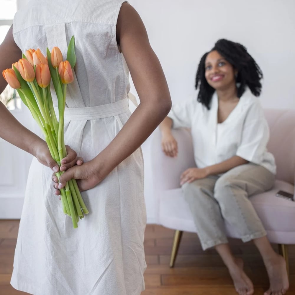 Woman holding colorful spring flower bouquet gift for mother