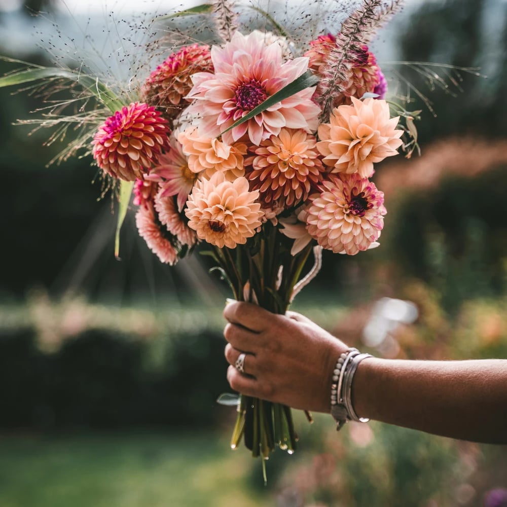 Florist arranging roses and seasonal flowers for Massachusetts delivery