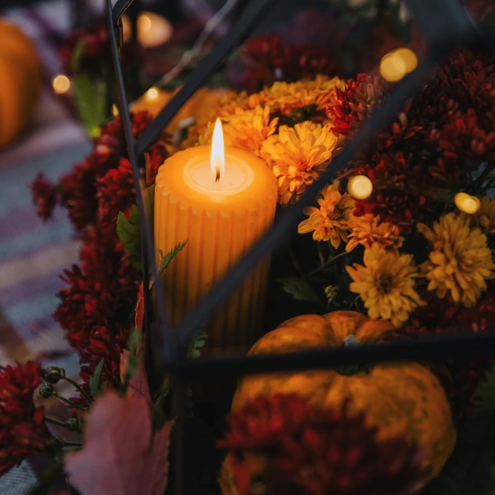 Pumpkin flower arrangement with orange gerberas and purple irises for Halloween