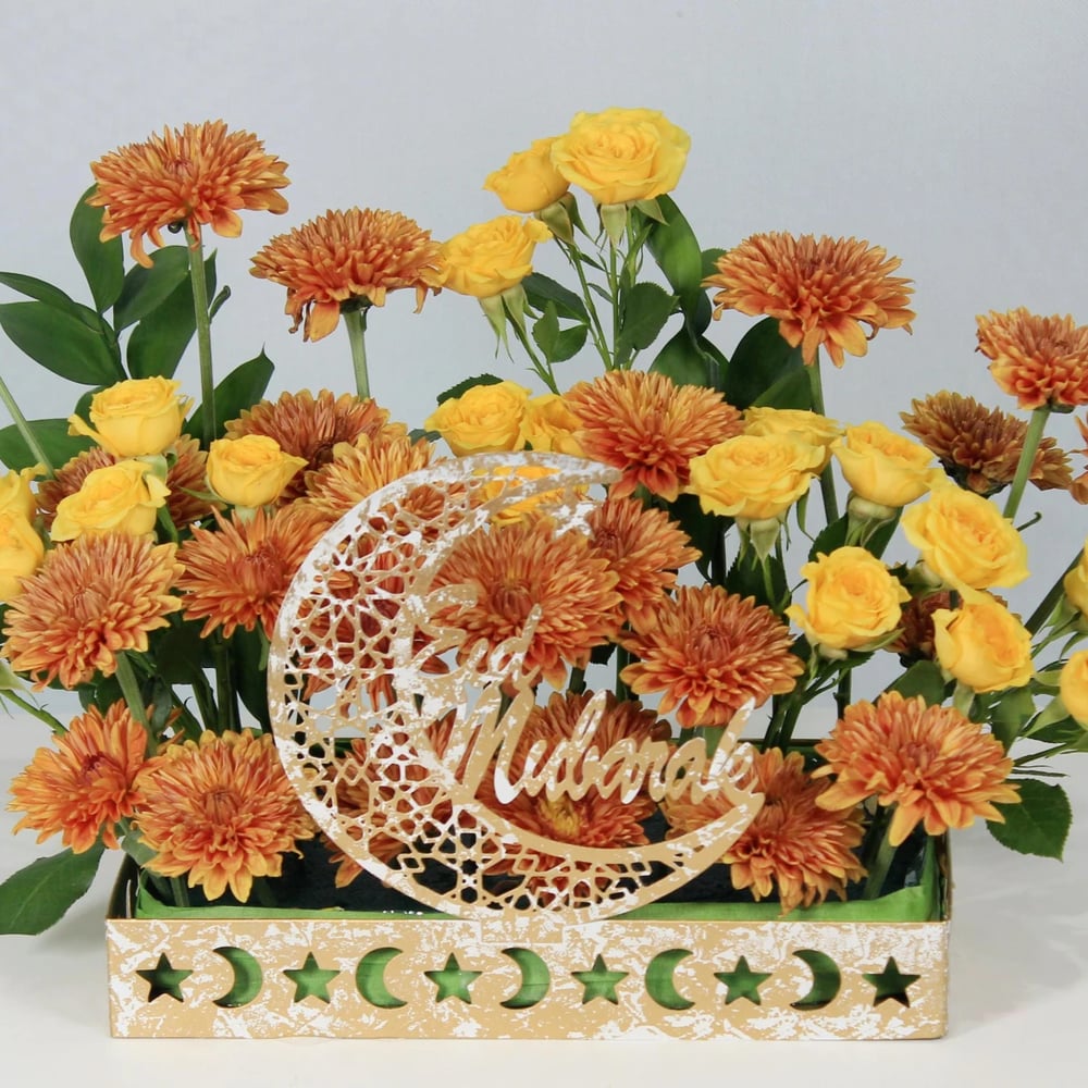 Eid flower gift with dates chocolates and Eid Mubarak card